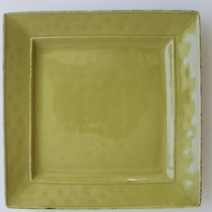 May include: A square serving platter with a raised rim and a distressed, green glaze.