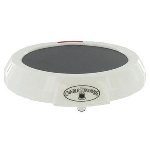 May include: White round electric candle warmer with a black heating surface and a red power button. The warmer has a "Candle Farmers" logo on the front.