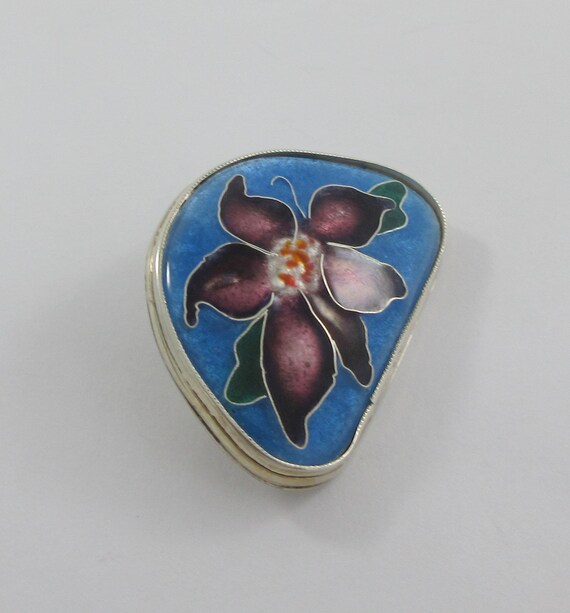 Seal in blue flowers on silver