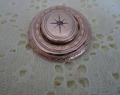 AVON PICTURE LOCKET brooch, gold tone, swivel centre, picture locket, rhinestone centre, 1.25 inches tall