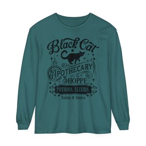 Black Cat Apothecary Shoppe Potions Elixirs Balms Tonics Fall October Halloween Spooky Vibes Unisex Comfort Colors Long Sleeve Tee