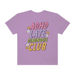 ADHD ADD Late Diagnosis Club Mental Health Retro Groovy Flowers Smiley Faces Comfort Colors Unisex Short Sleeve Tee