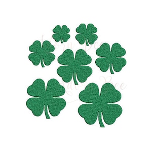 May include: A cluster of seven green four-leaf clovers, arranged in a circular pattern. The clovers are all the same size and shape, and they are all facing the same direction.