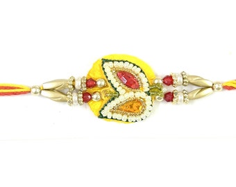 Rakhi Yellow Floral + Tika | Rakhri Yellow Leaves Design of Resin Stones, Pearl Beads, and Zari Strings Bracelet Unisex India