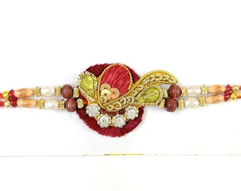 Rakhi Floral Red and Gold + Tika | Rakhri Maroon Paisley Silk Zari Work Beaded Cotton Strings Bracelet Unisex from India