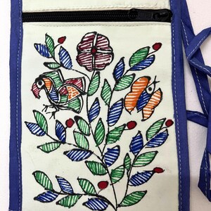 May include: A rectangular off-white fabric neck pouch featuring a black zipper closure and blue fabric trim. The front displays a hand-drawn style illustration of a bird, a butterfly, and a floral branch in red, green, and blue ink.