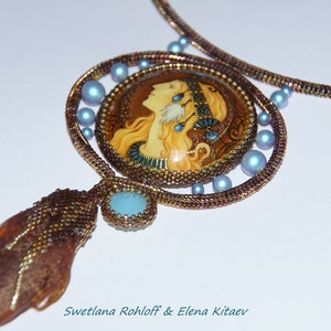 May include: A beaded necklace with a large, round pendant featuring a painted portrait of a woman with long blonde hair. The pendant is surrounded by smaller blue beads and the necklace is made of brown and gold beads.
