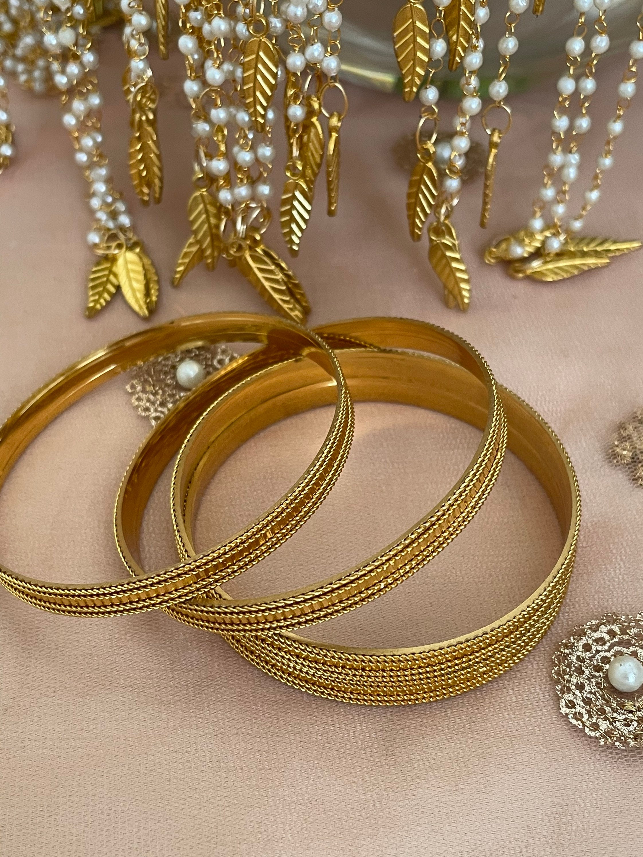 Gold bangles designs 4 set sale