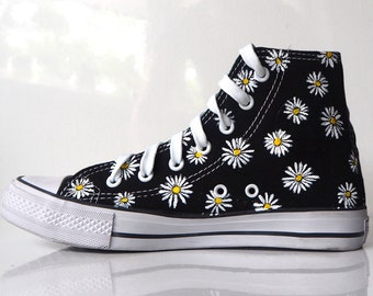 black converse with flowers