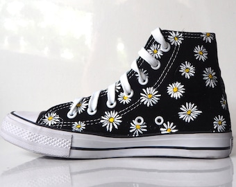 black converse with flowers