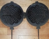 French antique large cast iron waffle maker ,with hearts around 1930 , heavy and long , handles removable , very nice condition