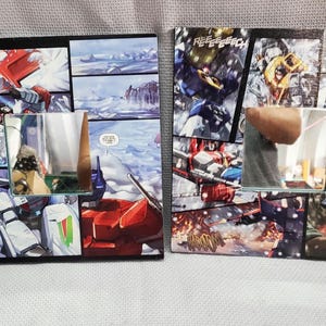 May include: Two rectangular wall mirrors featuring a collage of Transformers comic book panels. The artwork displays various robotic characters in action scenes with sound effect text like REEEEEEECH and KADOOMM. Each mirror has a square reflective center.