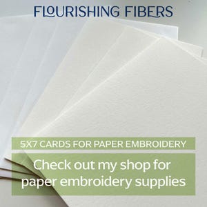 May include: A stack of white 5x7 inch cards for paper embroidery. The text "FLOURISHING FIBERS" is at the top. The image also includes the text "5X7 CARDS FOR PAPER EMBROIDERY" and "Check out my shop for paper embroidery supplies."