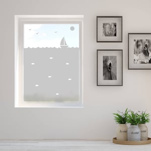 May include: A frosted window film featuring a sailboat and fish design. The film is applied to a window in a room with white walls, framed pictures, and potted plants.
