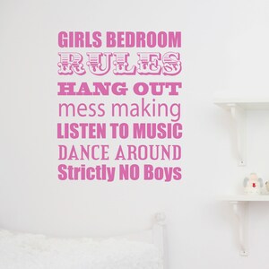 May include: Pink wall sticker with the text "GIRLS BEDROOM RULES" followed by "HANG OUT, mess making, LISTEN TO MUSIC, DANCE AROUND, Strictly NO Boys". The sticker is in a bedroom setting.