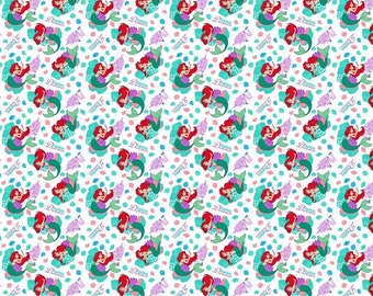 May include: A white background with a repeating pattern of Ariel, the Little Mermaid, in a green tail and a pink seashell bra. She is holding a seashell and has a pink flower in her hair. The background is filled with pink, blue, and green seashells and leaves.