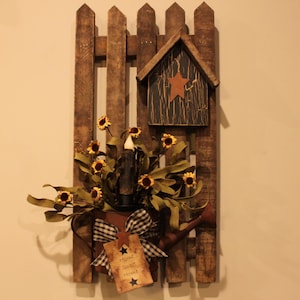 Decorated Tobacco Lath Fence with Rusty Sprinkling Can, Bird House, Bow, Kraft Tag and Daisies