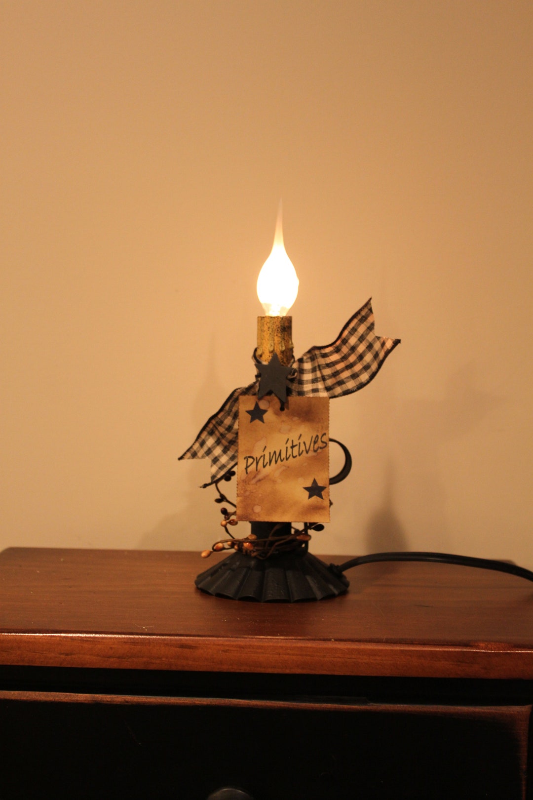 Grungy Black Fluted Candle Holder With an Electric Candleabra Light With Berries, Ribbon and