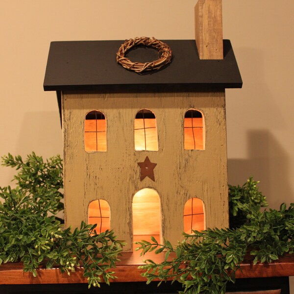 Wooden primitive house with low wattage bulb for ilumination
