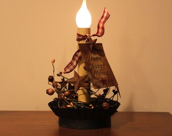 Grungy Black Fluted Candle Pan with an Electric Candleabra Light with berries, star and hang tag