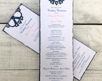 May include: A wedding ceremony program with a black and white design. The program lists the order of events for the wedding ceremony of Raymond Buchanan and James Solberg, which will take place on October 8, 2016 at the Historic Maxwell Room in Fort Lauderdale, Florida.