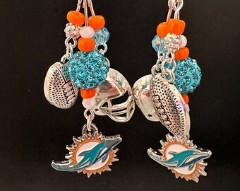 Miami Dolphins earring. Super fun lightweight earrings. Approximately 2 inches long. CheerfulEarful Available in posts or clips