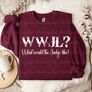 Vad skulle domaren vilja ha? Kläder, Rolig ridgåva för hästflicka, T-shirt med grafisk design, Hästdomares tävlingskläder