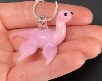 Pink Nessie Pendant - Glass Loch Ness Monster Sea Serpent Dinosaur Cryptid Necklace from Scottish Tartan Folklore