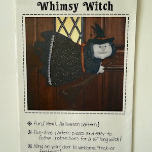 May include: A sewing pattern titled Whimsy Witch featuring a black and white fabric witch doll with a pointed hat, riding a broomstick. The paper includes text: Fun! New! Halloween pattern! Full-size pattern pieces and easy-to-follow instructions for a 16" long witch! Hang on your door to welcome "trick-or-treaters"!