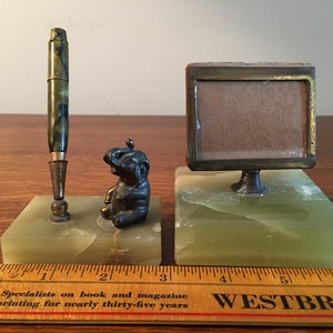 Antique marble, brass, and iron child&#39;s desk set with cast elephant, pen, and little frame