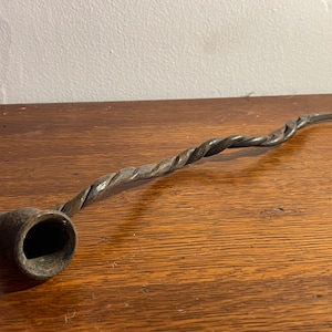 Whimsical and ornate, braided snuffer – early 20th century wrought iron