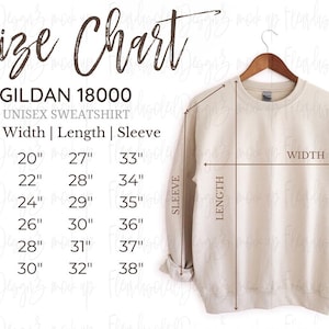 May include: A beige Gildan 18000 unisex sweatshirt on a wooden hanger. A size chart displays width, length, and sleeve measurements in inches for sizes S through 3XL, with arrows indicating where these measurements are taken on the garment.