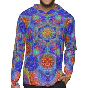 May include: A long-sleeved hoodie with a vibrant, psychedelic pattern in shades of blue, orange, and yellow. The intricate design features geometric shapes and floral motifs. The hoodie is paired with black shorts.