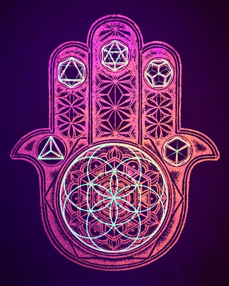 May include: A neon pink and purple Hamsa hand design with geometric shapes and patterns. The hand features a central mandala-like design with a flower of life pattern. The background is a dark purple.