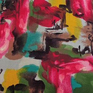 May include: Abstract fabric with a colorful design featuring shades of pink, yellow, green, teal, brown, and black. The fabric has a brushstroke pattern.