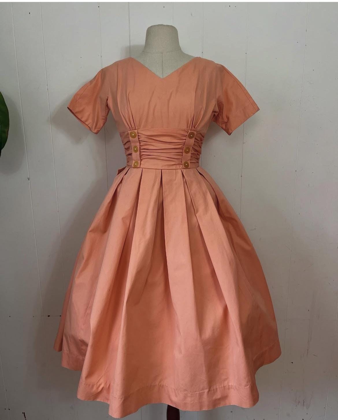 1950s “Teena Paige” peach cotton rushed cummerbund waist dress