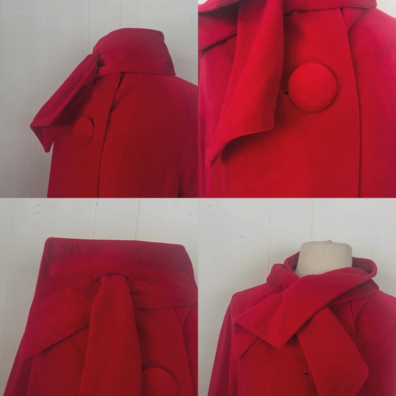 May include: A vibrant red coat with a unique design. The coat features a large, rounded collar and a prominent, oversized button. The fabric appears to be a soft material, and the coat has a distinctive, flowing shape.