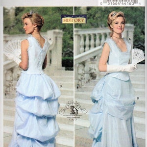 May include: A vintage sewing pattern for a light blue dress with a bustle. The pattern is for sizes 14-16-18-20 and is from Butterick. The pattern is called "Making History".