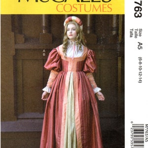 May include: McCall's Costumes sewing pattern M7763 size A5 (6-8-10-12-14) for a Renaissance-style gown with a long, flowing skirt, a fitted bodice, and a high neckline. The gown is red with gold trim and a white underlayer. The model is wearing a white headpiece.