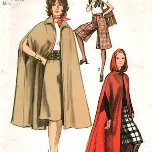 May include: Vintage Simplicity sewing pattern featuring three fashion styles: a midi-length cape, culottes, and a maxi-length cape. The pattern includes sizing information for a size 12, with a bust of 34 inches and a waist of 25.5 inches. The price is $1.00.