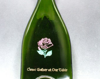 Slumped, flattened  and engraved wine bottle trivet