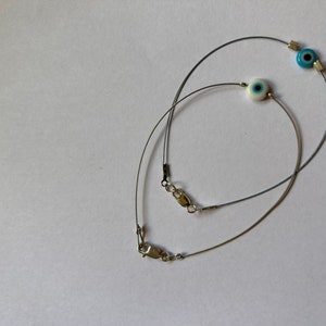 Hamsa wire bracelet. Holy Land blessing bracelet. Evil eye protection wire bracelet. Blue eye bracelet. Sterling evil eye jewelry.