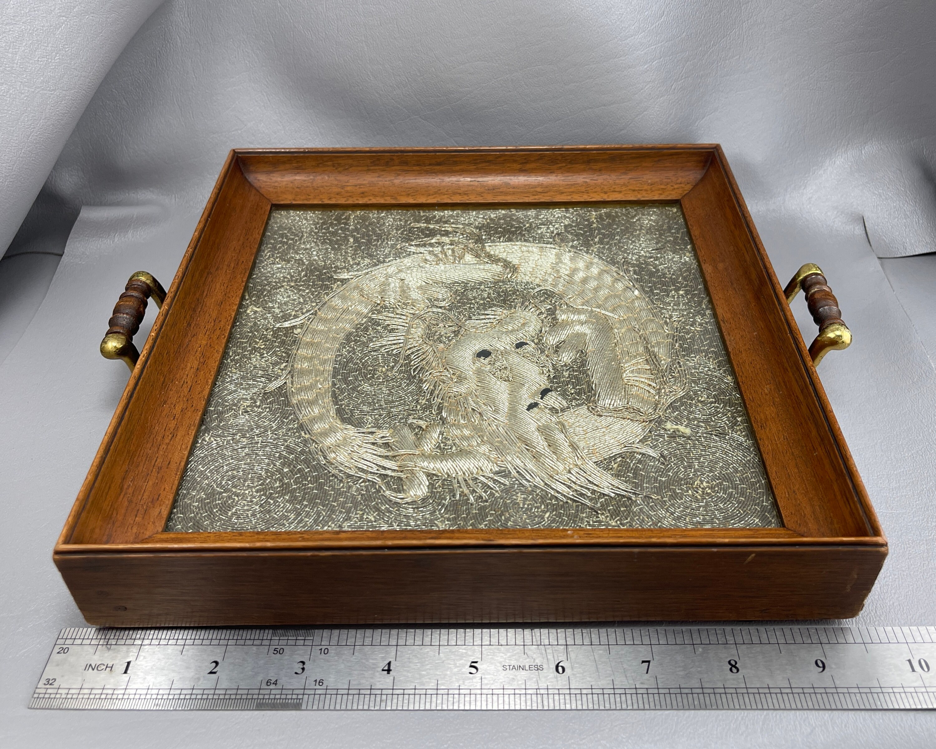 Antique Japanese Silver Embroidered Dragon Textile, in Glass