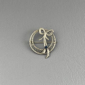 Art Deco 10 Karat White Gold Engraved Brooch with Blue Stone-7/8 Inch Across. Free shipping.