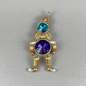 Articulated Pierrot Brooch, with Purple and Blue Glass Rivioli Rhinestones-3 1/4 Inches Long. Free shipping.