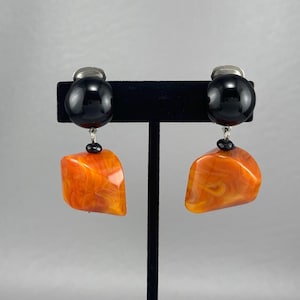 1980s Chunky Orange Swirl and Black Lucite Clip Earrings-1 7/8 Inches Long. Free shipping.