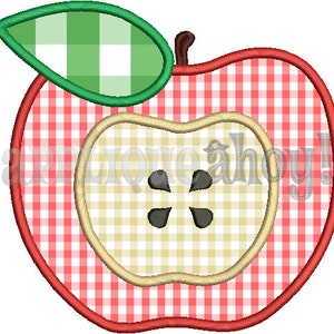 May include: Red and white gingham apple with a green gingham leaf and a yellow gingham center. The apple has a black five-pointed star in the center.