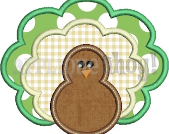 May include: A brown turkey with a green and white polka dot tail feathers. The turkey is surrounded by a white and yellow checkered pattern.