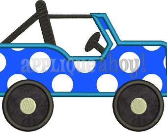 Puede incluir: Aplique de jeep azul y blanco con lunares, con ruedas negras y un rollo de barra negro.
