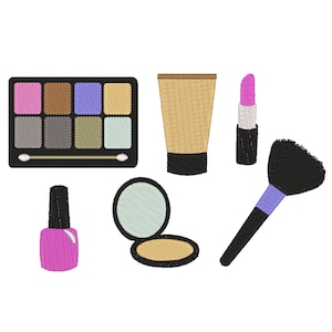 Puede incluir: Un conjunto de artículos de maquillaje que incluye una paleta de sombras de ojos, base de maquillaje, lápiz labial, esmalte de uñas y una brocha de maquillaje.